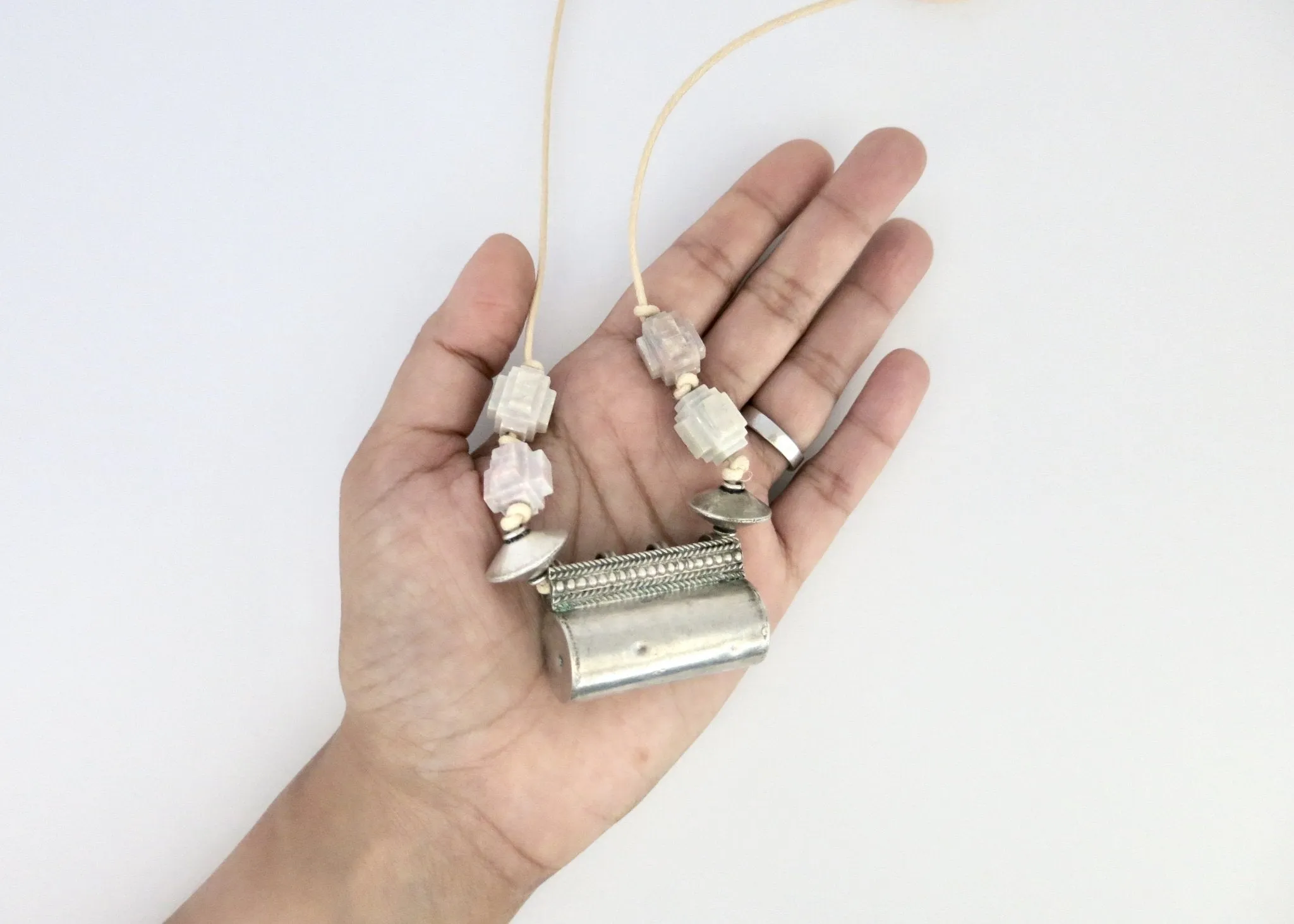 Architecturally inspired, tubular Rajasthani tribal amulet