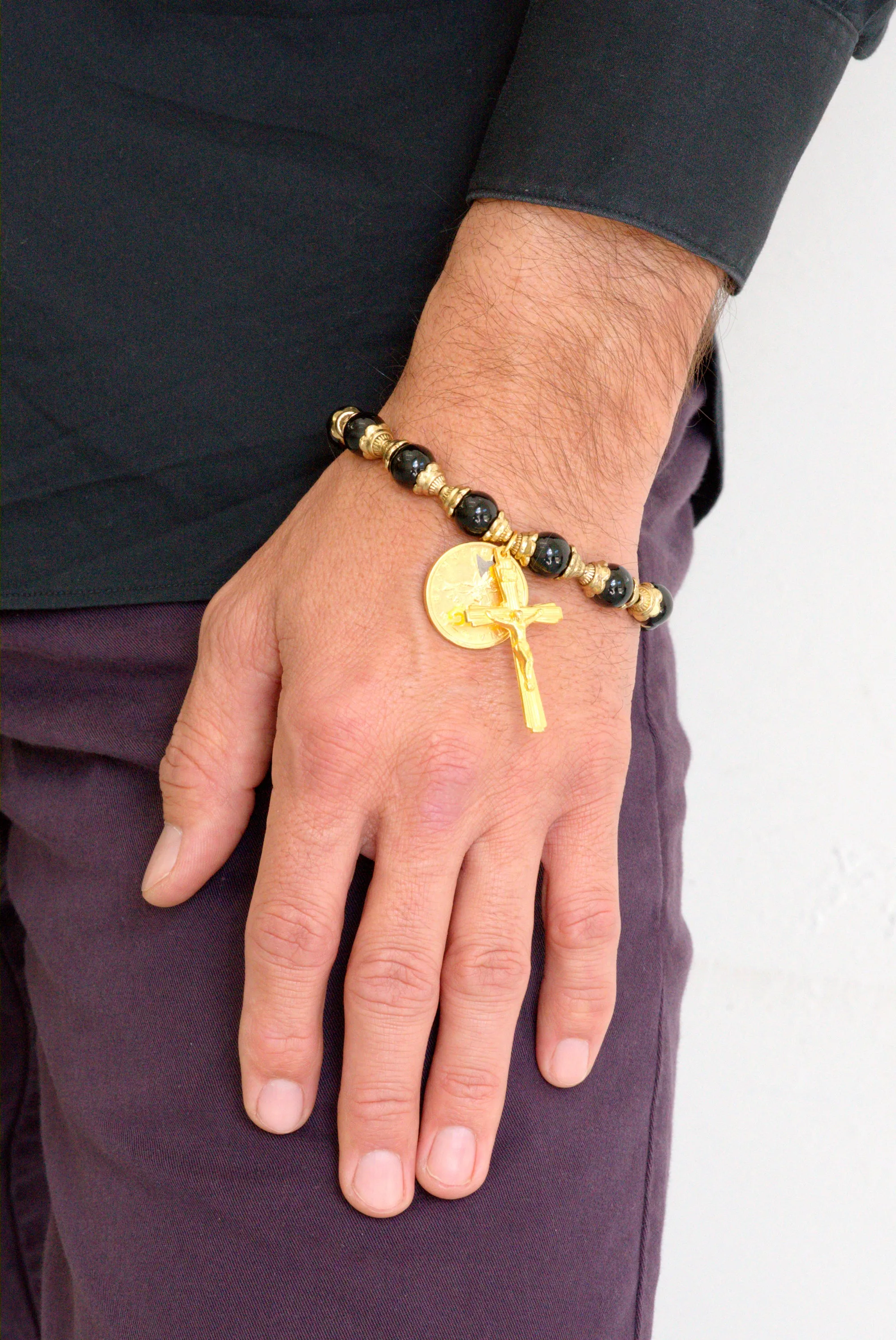 Black onyx and gold crucifix bracelet