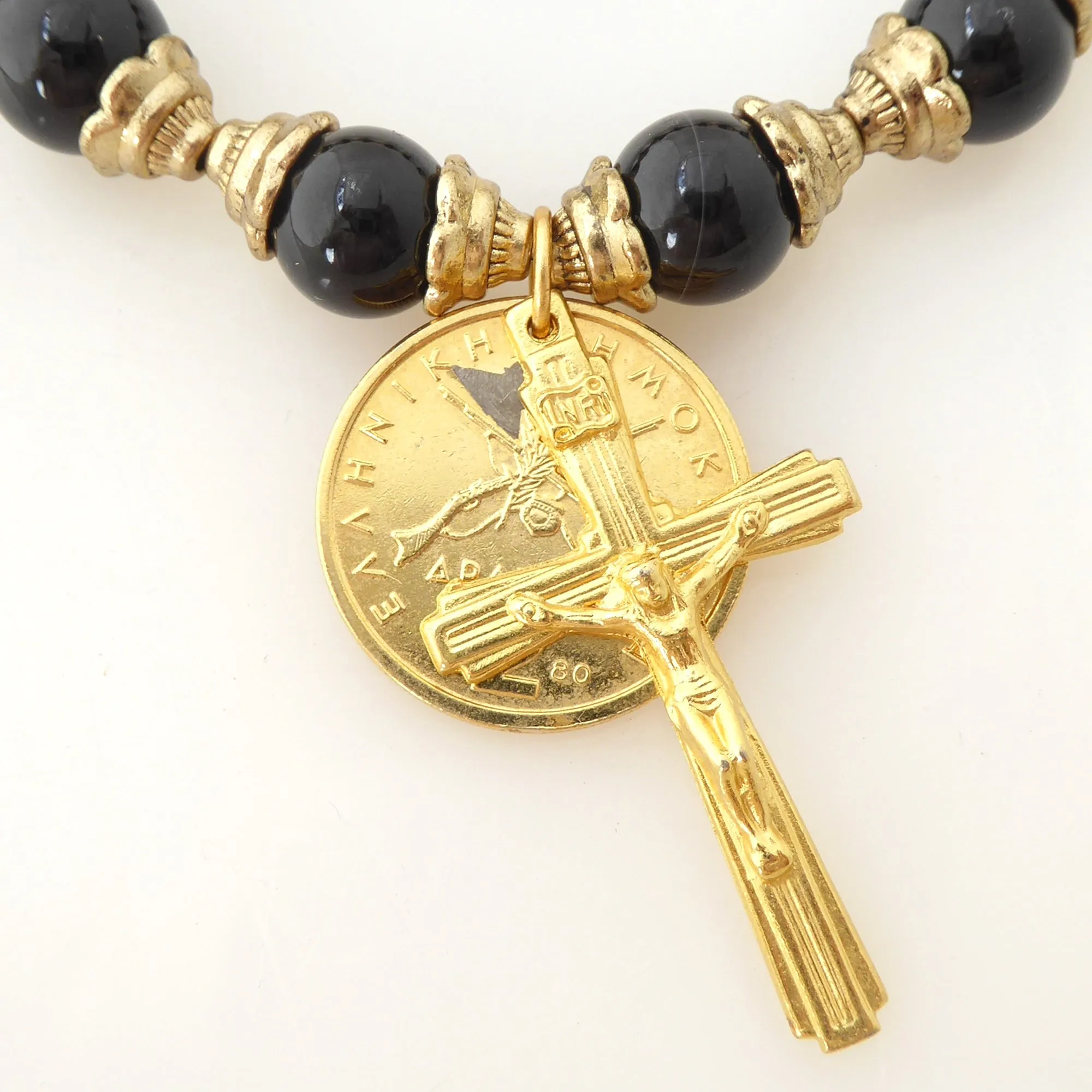 Black onyx and gold crucifix bracelet