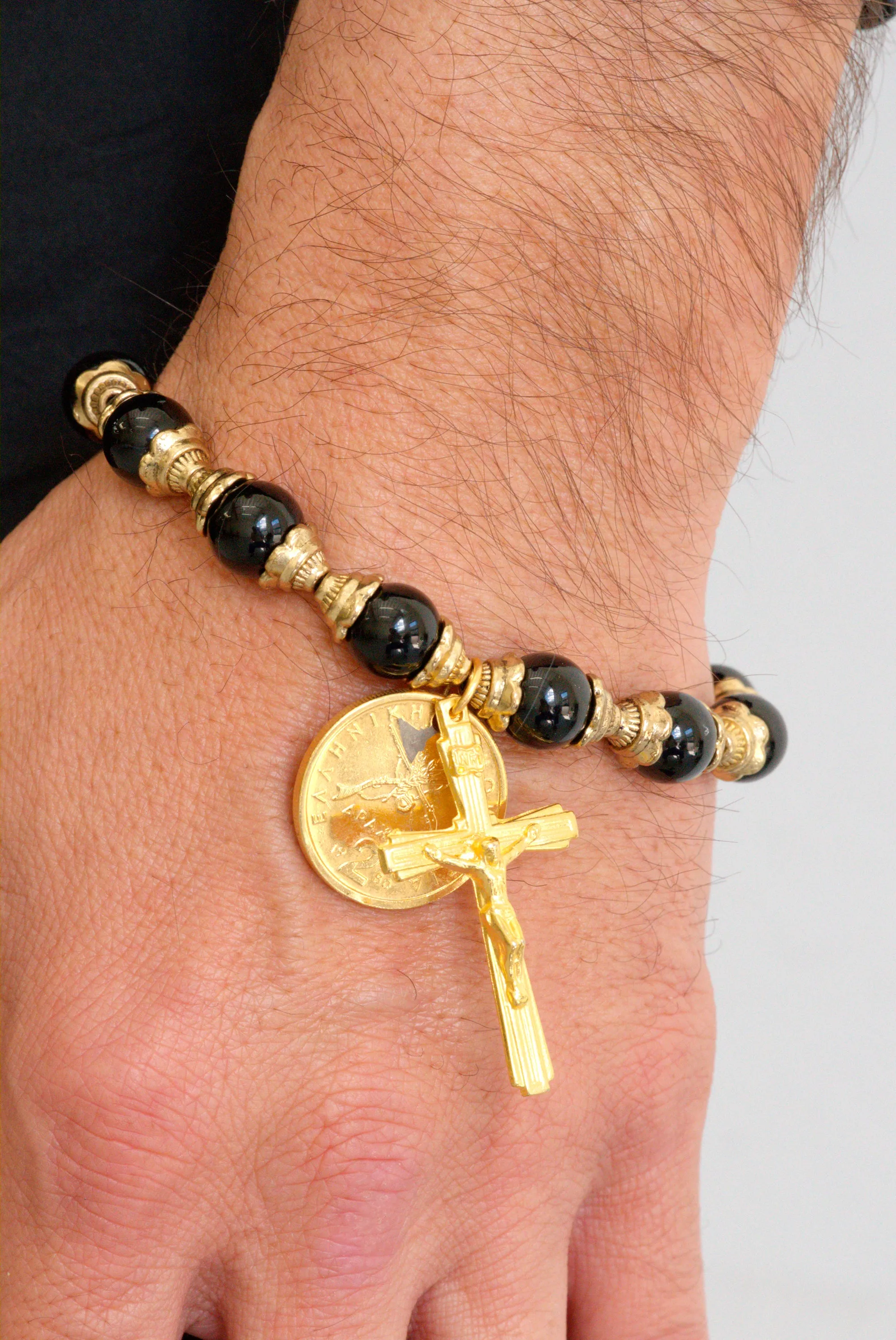 Black onyx and gold crucifix bracelet