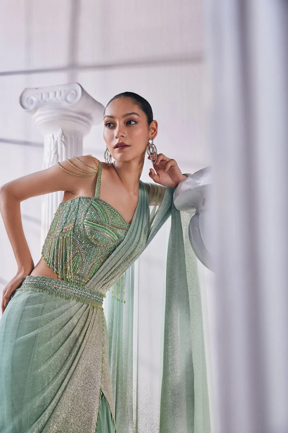 Draped Layer Lehenga In Sequin And Pleated Gold Foil Lycra. The Corsetfeatures Heavy Beads, Tassels And Zardozi Work.