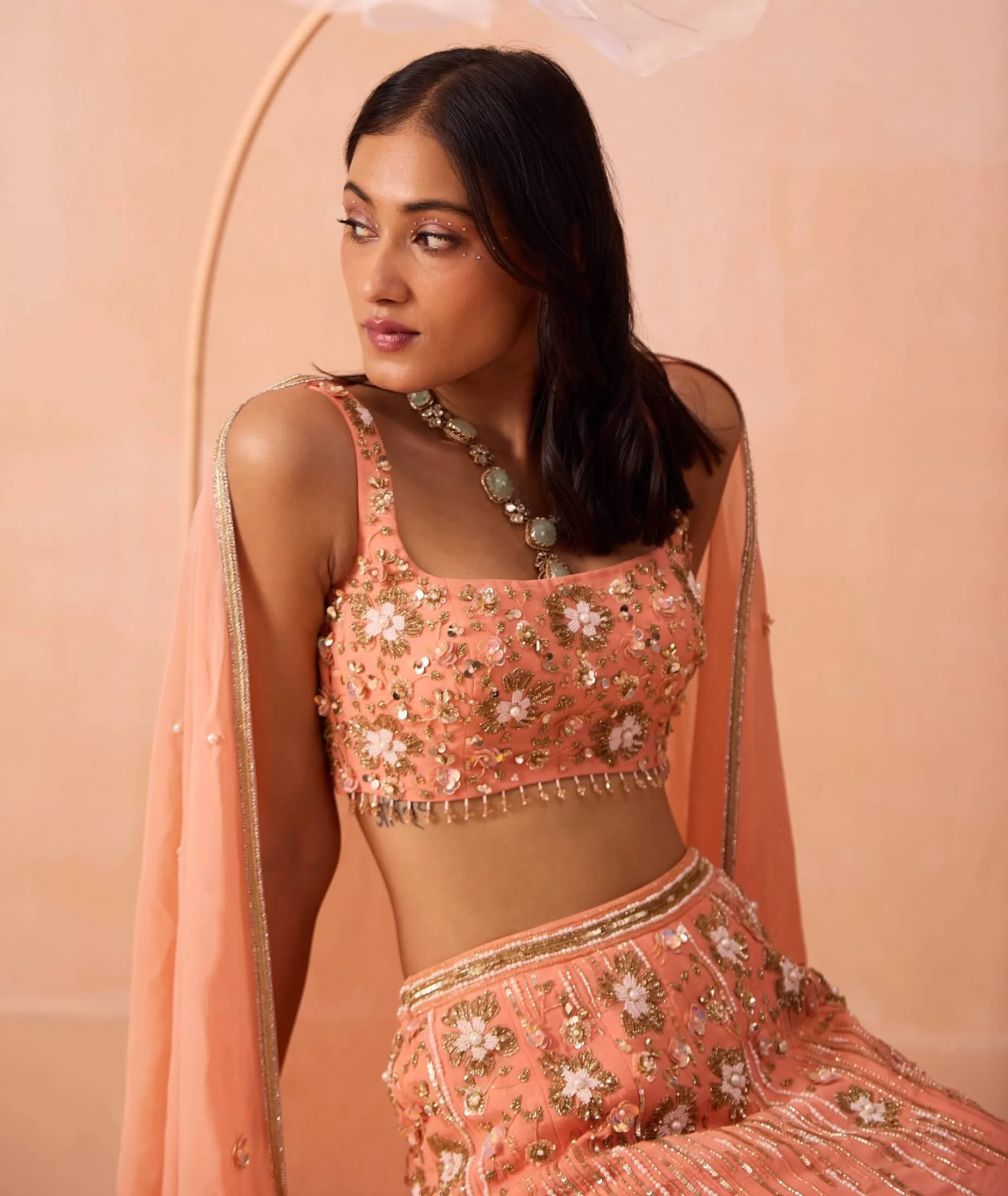 Peachy pearl embellished lehenga set